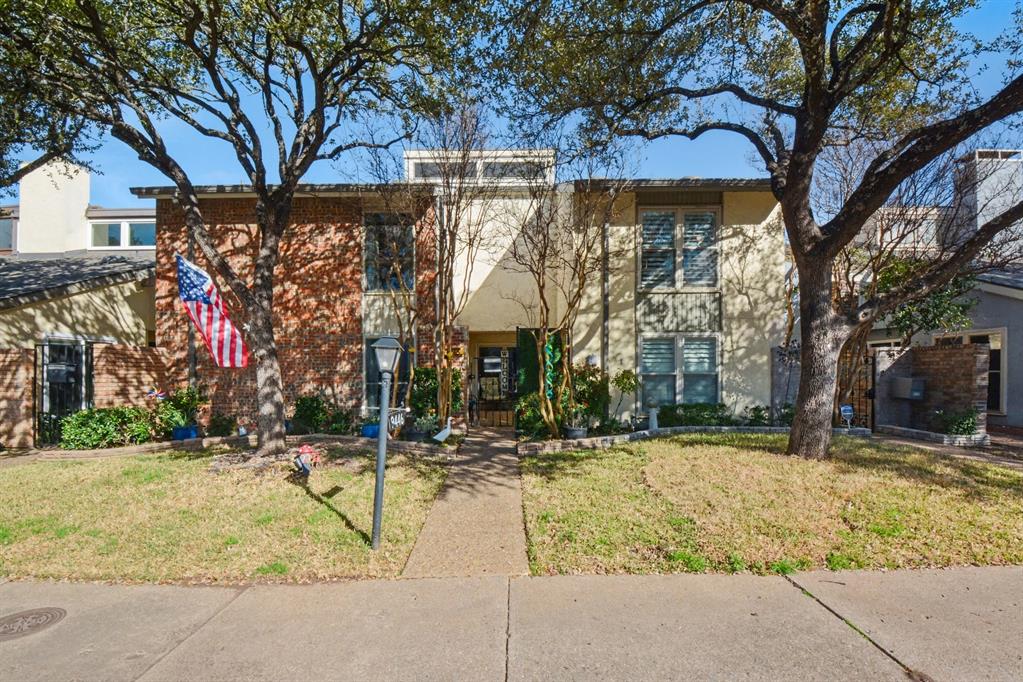 9446 Chimney Corner Dallas, TX 75243 - Photo 1 of 39 a view of street with large trees