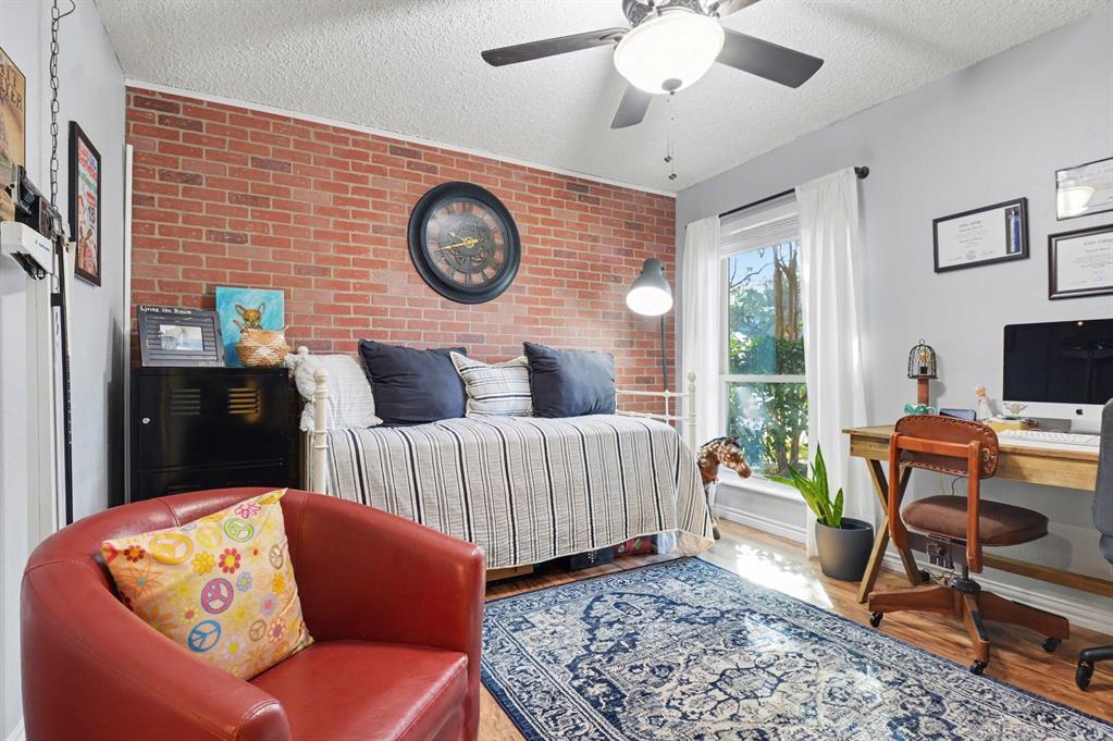 9446 Chimney Corner Dallas, TX 75243 - Photo 18 of 39 a living room with furniture and a flat screen tv