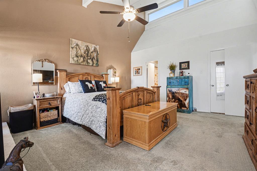 9446 Chimney Corner Dallas, TX 75243 - Photo 19 of 39 a bedroom with furniture and a bed