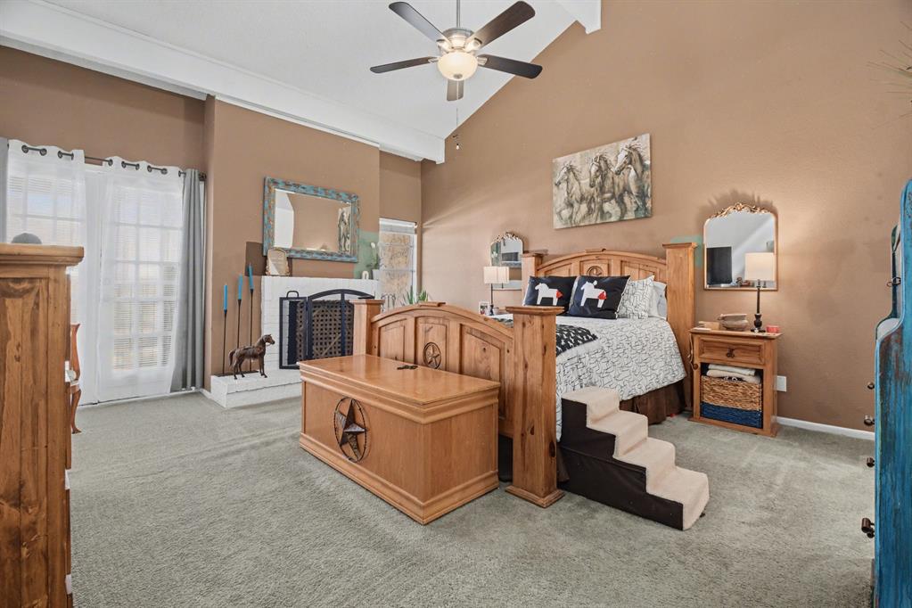 9446 Chimney Corner Dallas, TX 75243 - Photo 20 of 39 a bed room with a bed and a chair