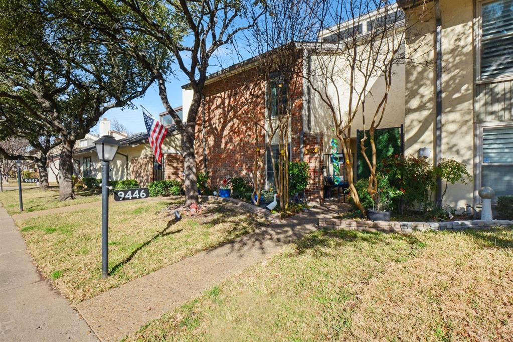 9446 Chimney Corner Dallas, TX 75243 - Photo 2 of 39 a view of a yard with a tree