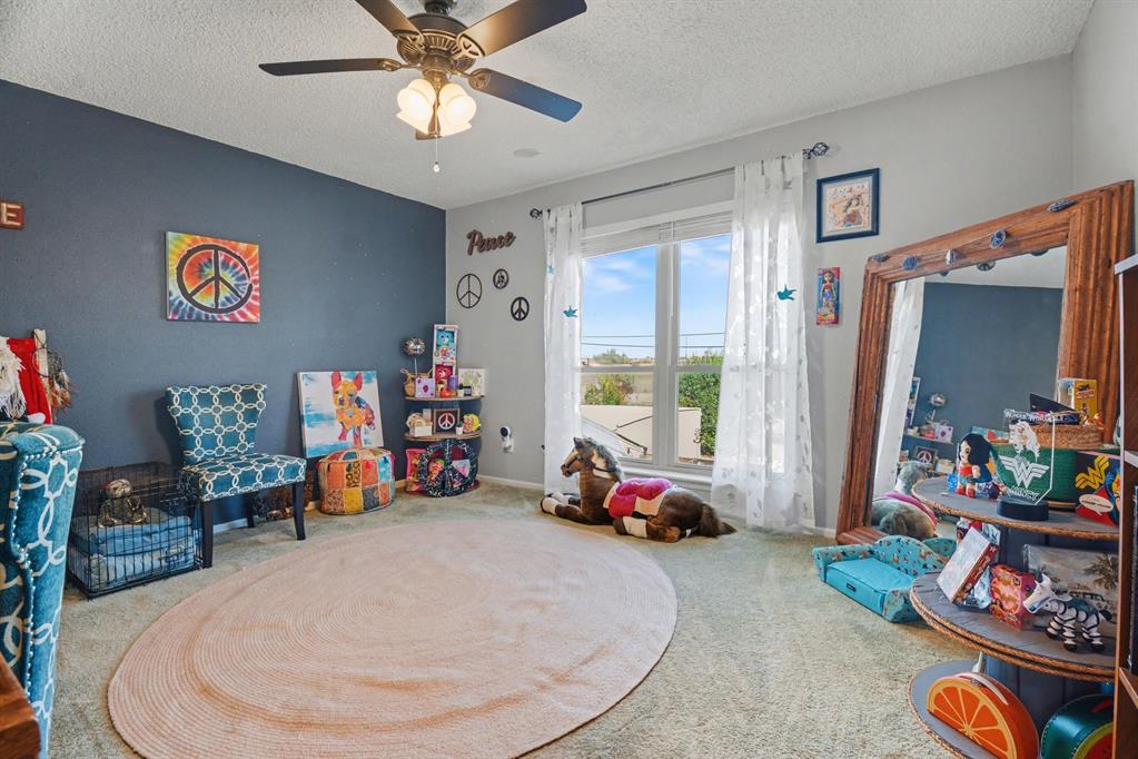 9446 Chimney Corner Dallas, TX 75243 - Photo 29 of 39 a room with toys and a wooden floor