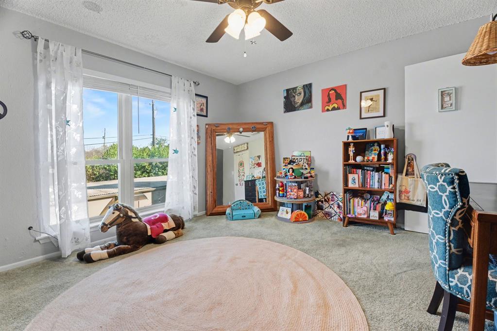 9446 Chimney Corner Dallas, TX 75243 - Photo 30 of 39 a view of a livingroom with furniture and a large window
