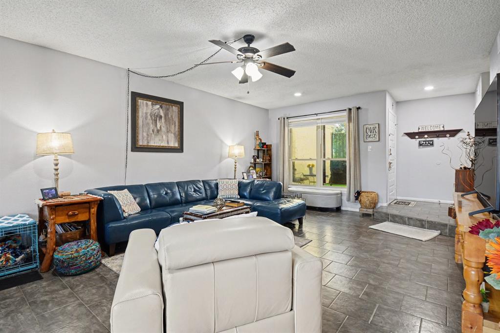 9446 Chimney Corner Dallas, TX 75243 - Photo 3 of 39 a living room with furniture and a window