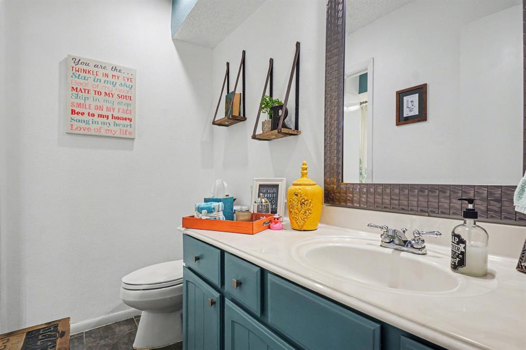 9446 Chimney Corner Dallas, TX 75243 - Photo 31 of 39 a bathroom with a sink and a toilet