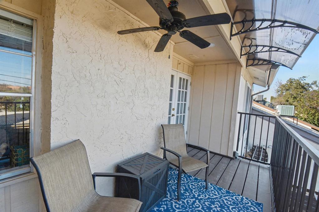 9446 Chimney Corner Dallas, TX 75243 - Photo 35 of 39 a view of a hallway with couches and a dining table