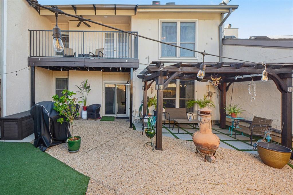 9446 Chimney Corner Dallas, TX 75243 - Photo 39 of 39 a view of a chair and table in backyard of the house