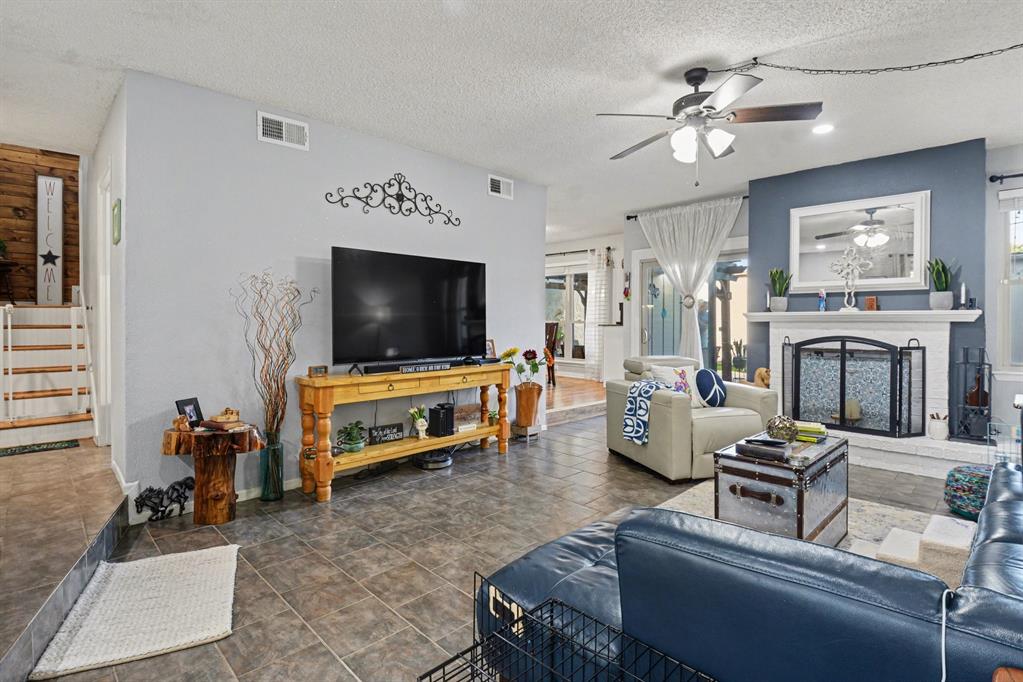 9446 Chimney Corner Dallas, TX 75243 - Photo 5 of 39 a living room with furniture and a flat screen tv