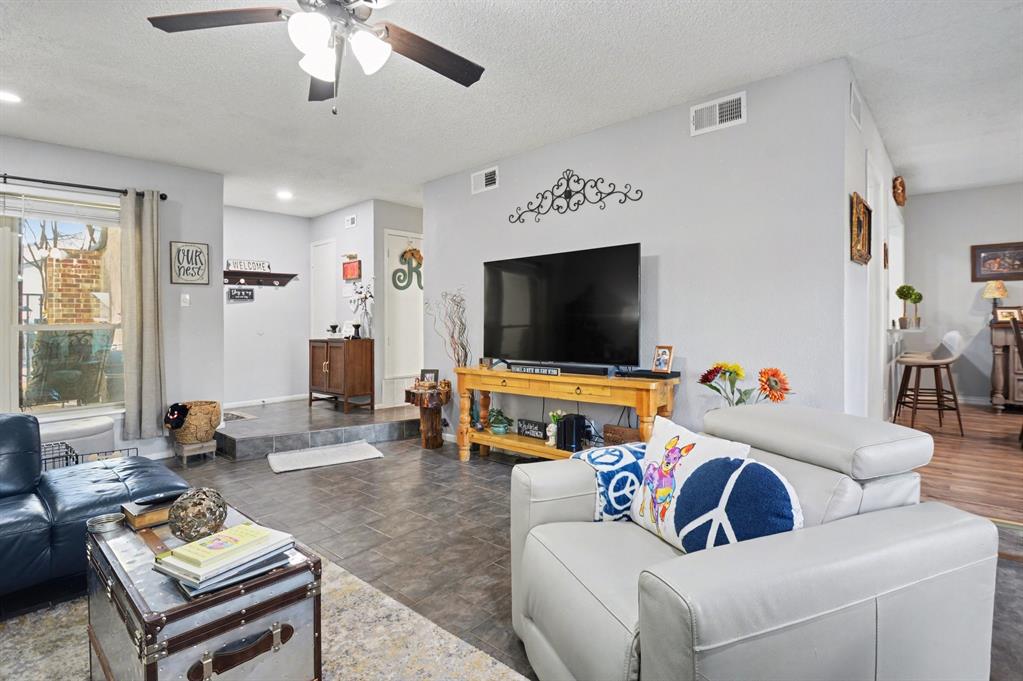 9446 Chimney Corner Dallas, TX 75243 - Photo 6 of 39 a living room with furniture and a flat screen tv