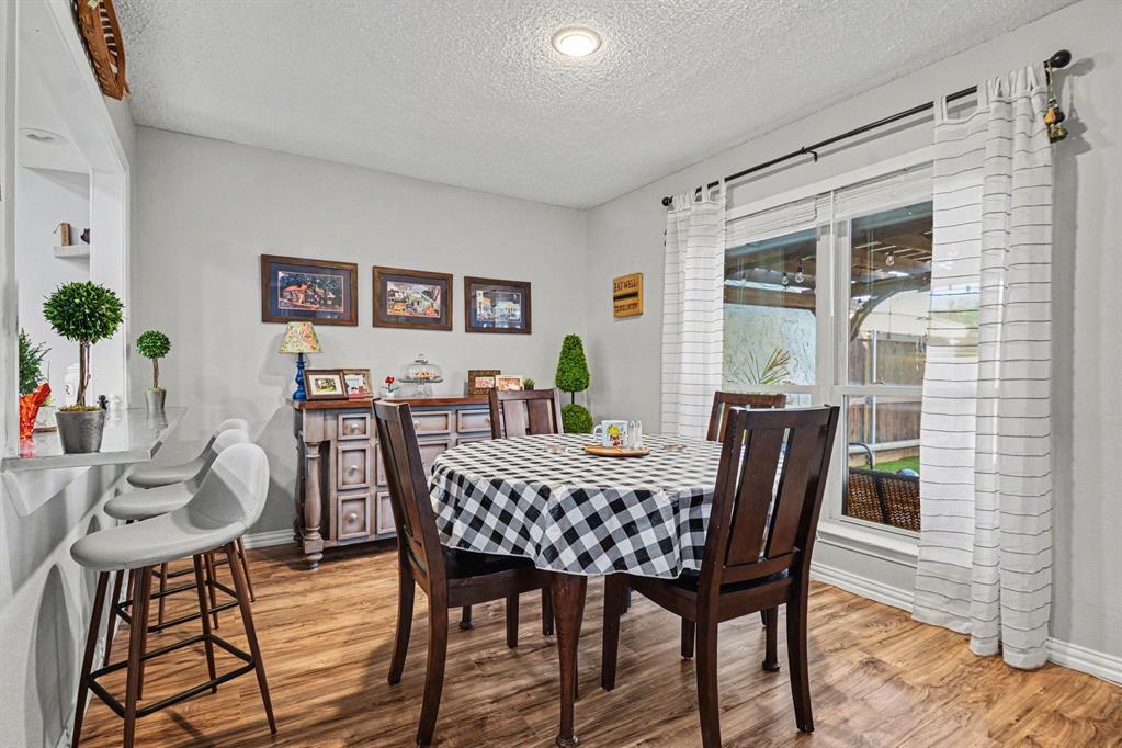 9446 Chimney Corner Dallas, TX 75243 - Photo 7 of 39 a view of a dining room with furniture