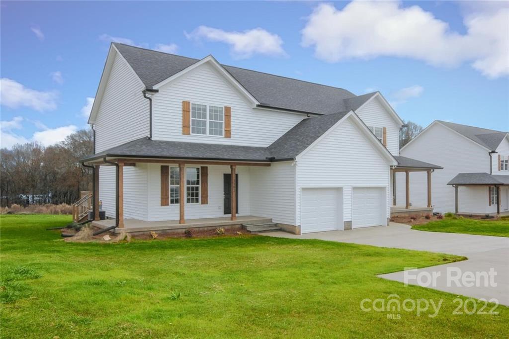 1100 Startown Road Lincolnton, NC 28092 - Photo 1 of 48 a front view of a house with a yard and porch