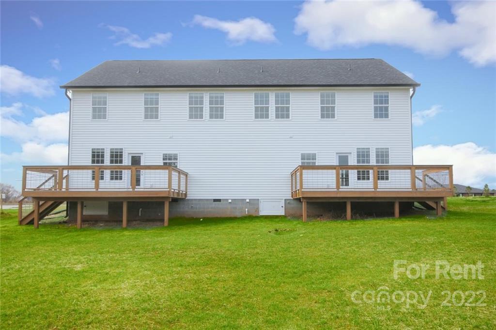 1100 Startown Road Lincolnton, NC 28092 - Photo 44 of 48 a backyard of a house with table and chairs
