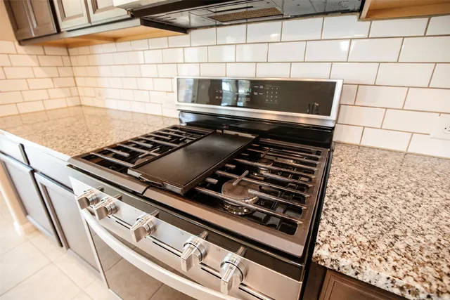 an empty room with fan and windows