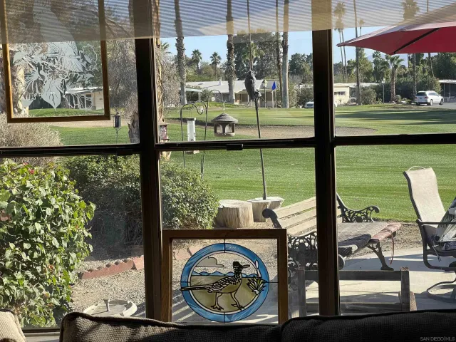 a view of a two chairs in the patio