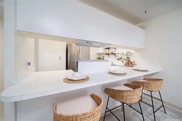 a kitchen with cabinets and stainless steel appliances