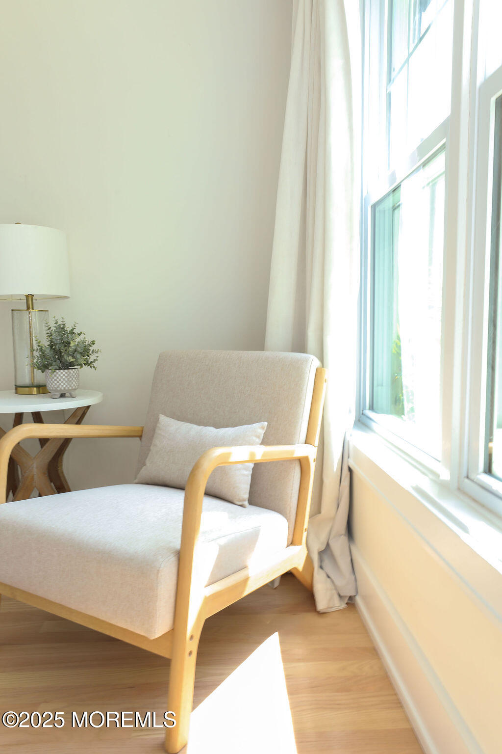 153 Atlantic Avenue Long Branch, NJ 07740 - Photo 17 of 46 a living room with a couch and a table