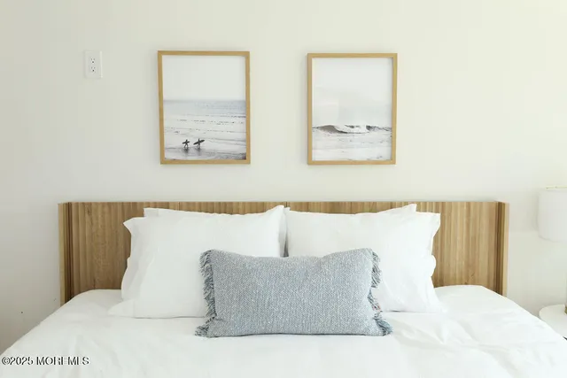 a large white bed in a white room