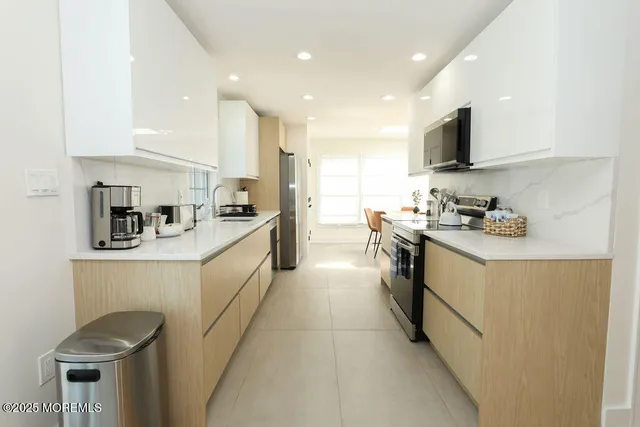 a bedroom with a bed and a mirror