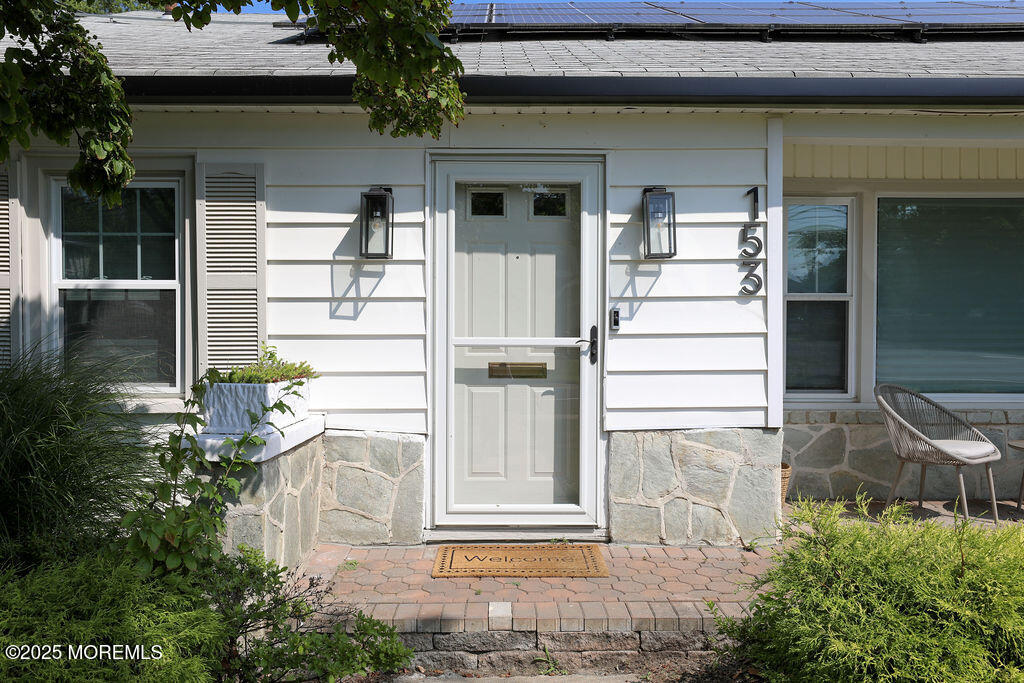 153 Atlantic Avenue Long Branch, NJ 07740 - Photo 2 of 46 a front view of a house with a yard