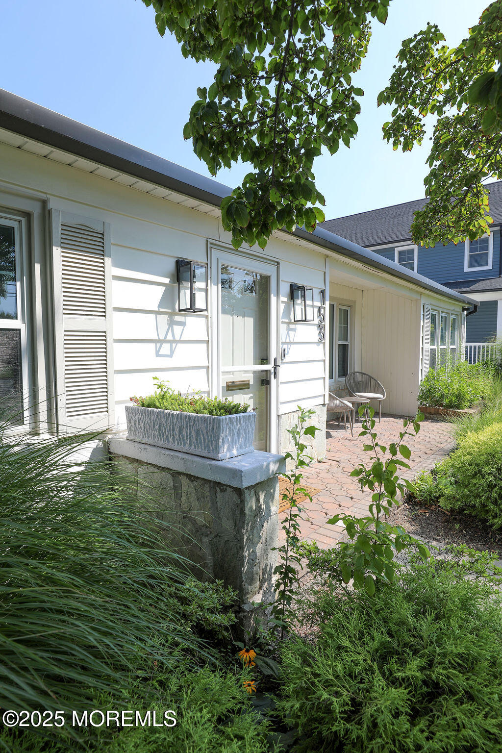 153 Atlantic Avenue Long Branch, NJ 07740 - Photo 3 of 46 a backyard of a house with table and chairs