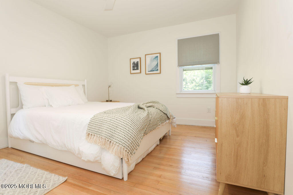 153 Atlantic Avenue Long Branch, NJ 07740 - Photo 32 of 46 a large white bed in a white room