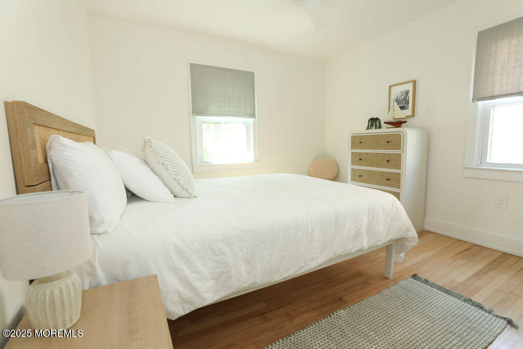 153 Atlantic Avenue Long Branch, NJ 07740 - Photo 35 of 46 a large bed sitting in a bedroom next to a window
