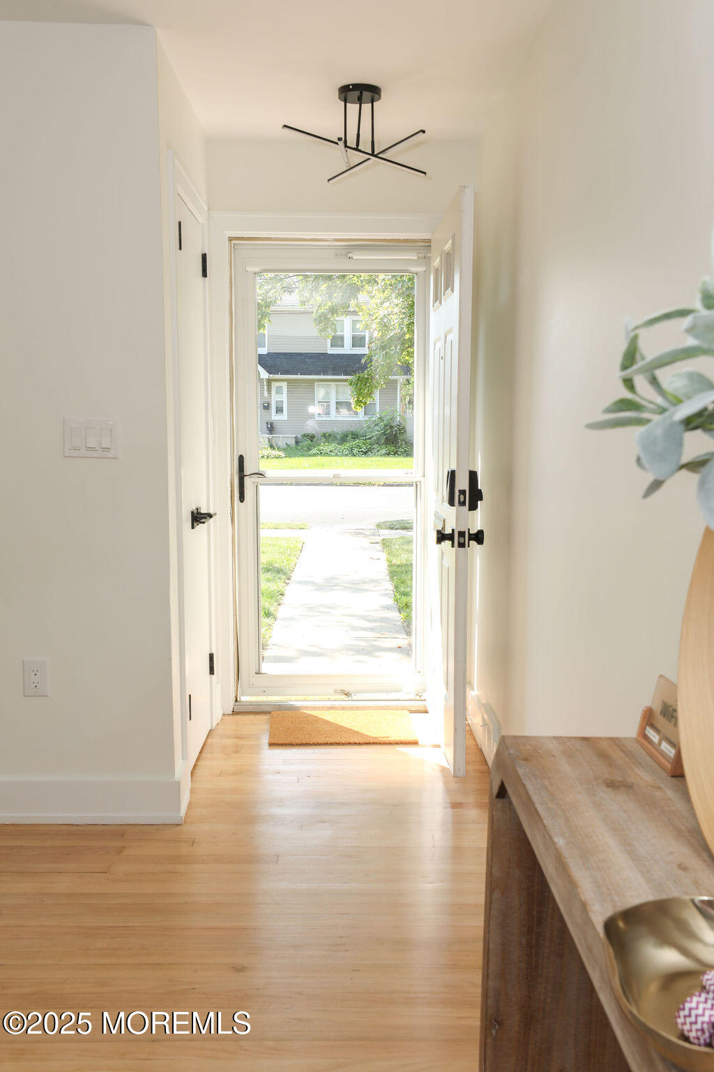 153 Atlantic Avenue Long Branch, NJ 07740 - Photo 4 of 46 a view of livingroom with furniture window and wooden floor