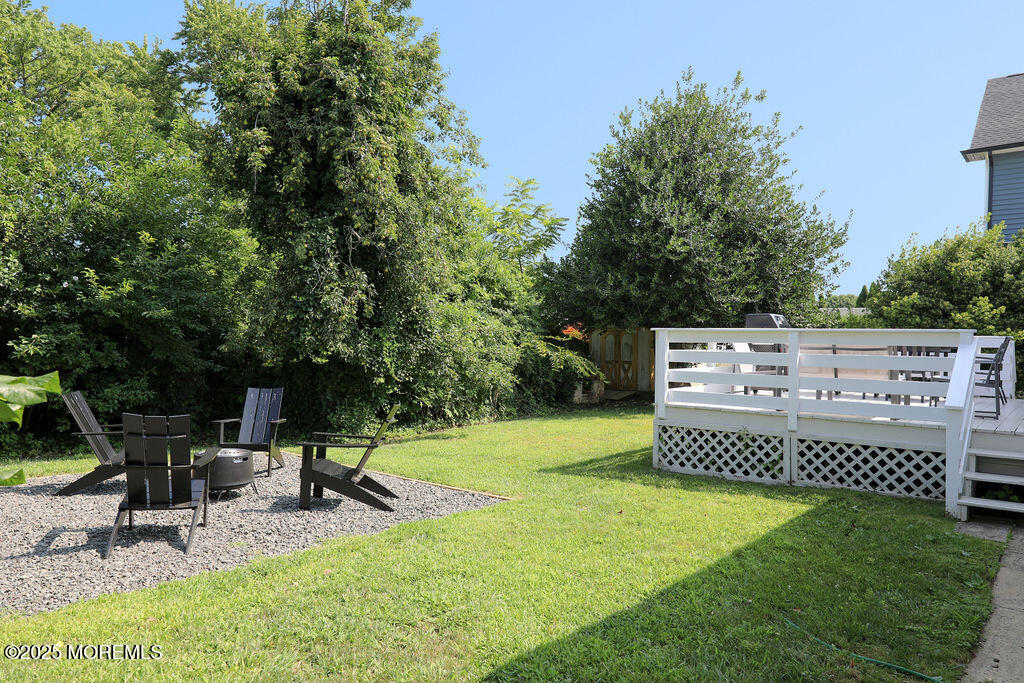 153 Atlantic Avenue Long Branch, NJ 07740 - Photo 45 of 46 a view of a chairs and tables in the back yard