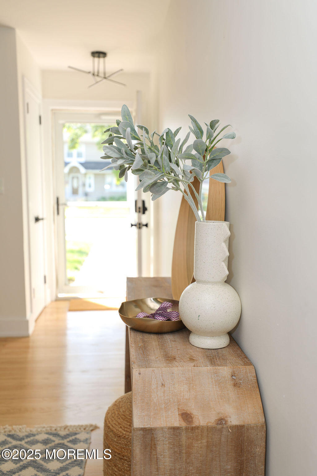 153 Atlantic Avenue Long Branch, NJ 07740 - Photo 5 of 46 a vase of flowers sitting on a table