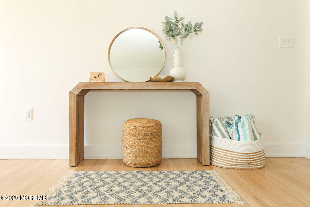 153 Atlantic Avenue Long Branch, NJ 07740 - Photo 7 of 46 a bedroom with bed and a chair