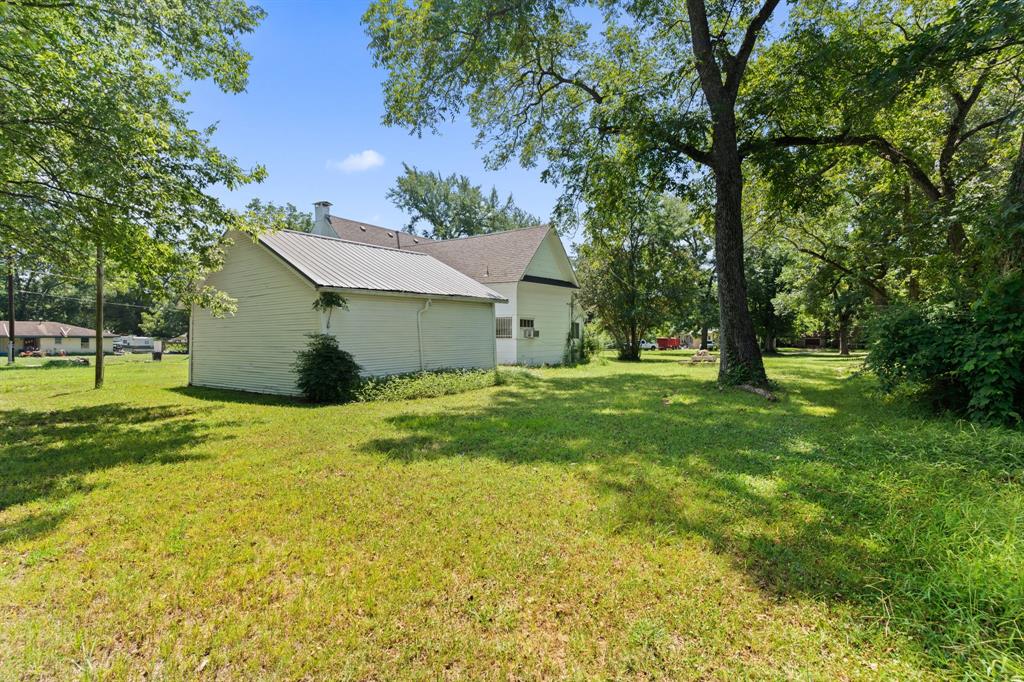 260 South Main Street Detroit, TX 75436 - Photo 12 of 20 a view of a house with a yard