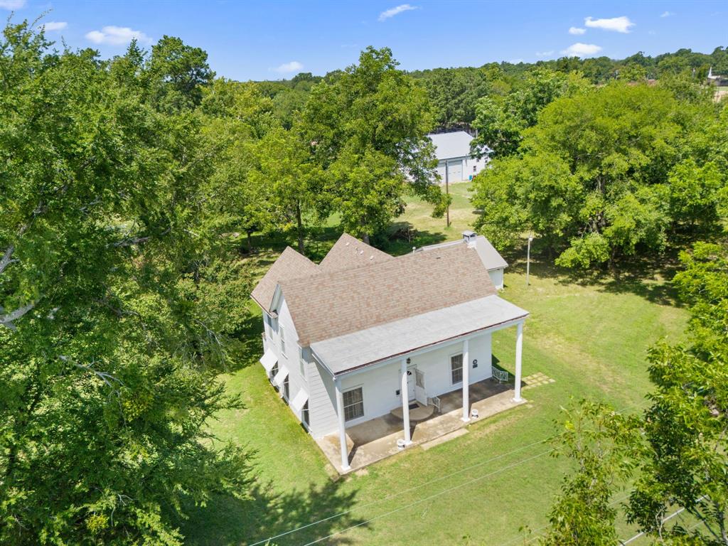 260 South Main Street Detroit, TX 75436 - Photo 14 of 20 an aerial view of a house with a yard