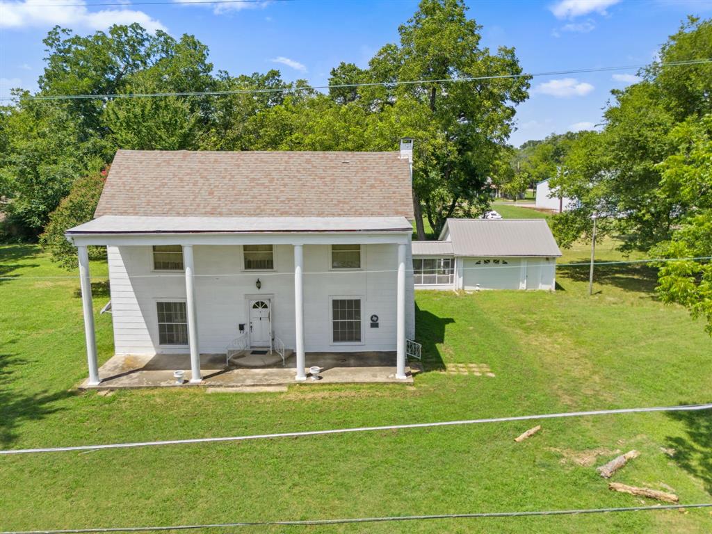 260 South Main Street Detroit, TX 75436 - Photo 15 of 20 a view of a house with pool table and chairs