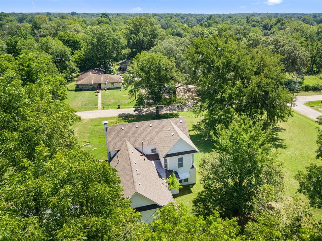 260 South Main Street Detroit, TX 75436 - Photo 18 of 20 an aerial view of a house with swimming pool and garden view