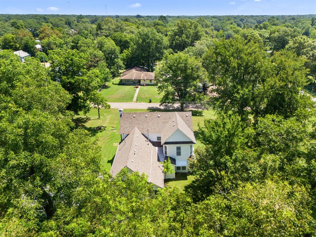 260 South Main Street Detroit, TX 75436 - Photo 19 of 20 an aerial view of a house with a yard
