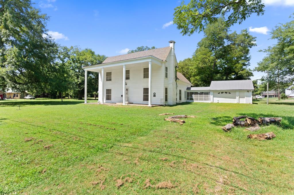 260 South Main Street Detroit, TX 75436 - Photo 3 of 20 a front view of house with yard