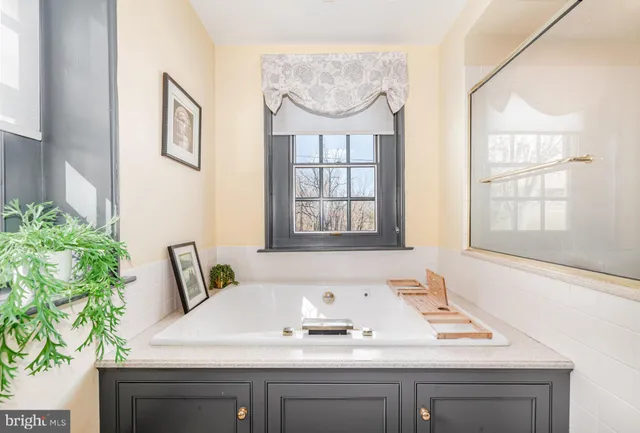 a room with a bed and furniture