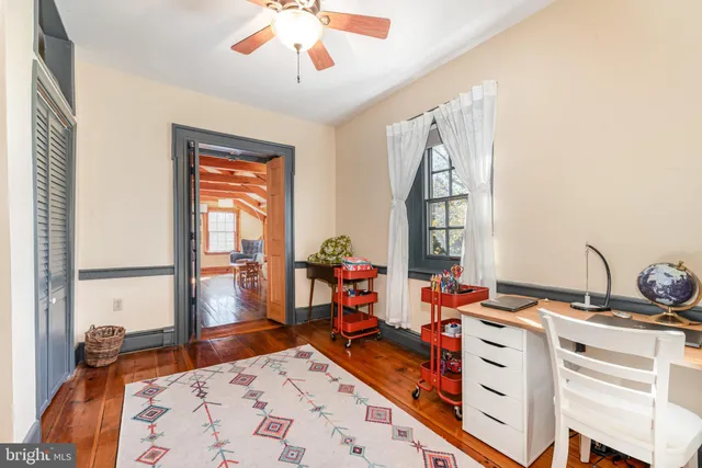 a view of a living room and balcony with furniture