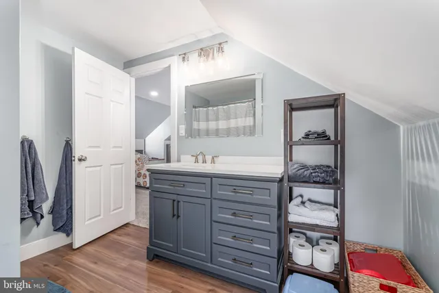 a view of a livingroom with furniture and floor to ceiling window