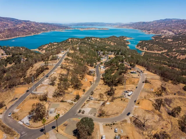 an aerial view of mountain with an ocean