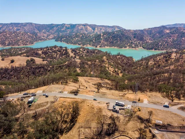an aerial view of residential house and sandy dunes