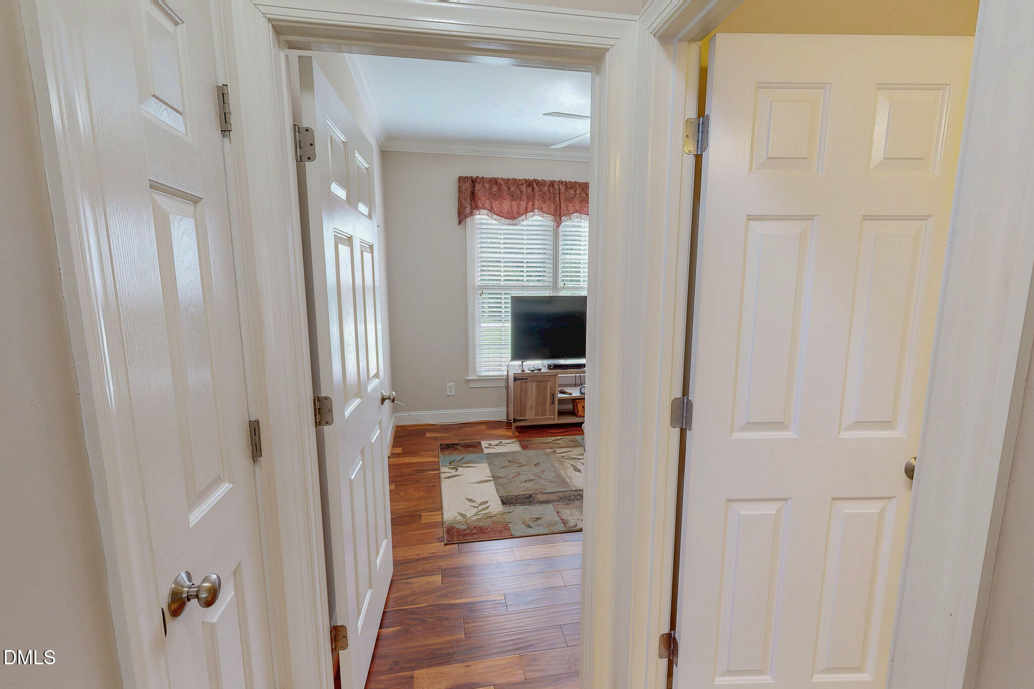 115 Duncan Plantation Road Timberlake, NC 27583 - Photo 40 of 48 a view of a hallway with wooden floor windows and livingroom
