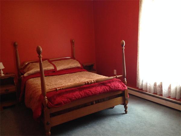 430 Scott Road Oakham, MA 01068 - Photo 6 of 11 a bedroom with a bed and a potted plant