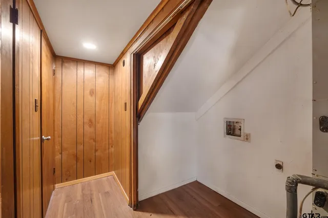 a view of hallway with wooden floor