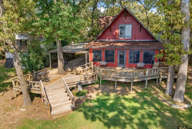 a view of house with yard outdoor seating and city view