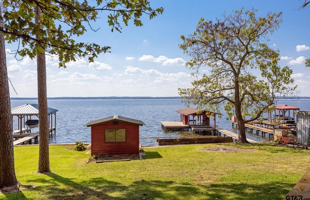 a swimming pool with outdoor seating