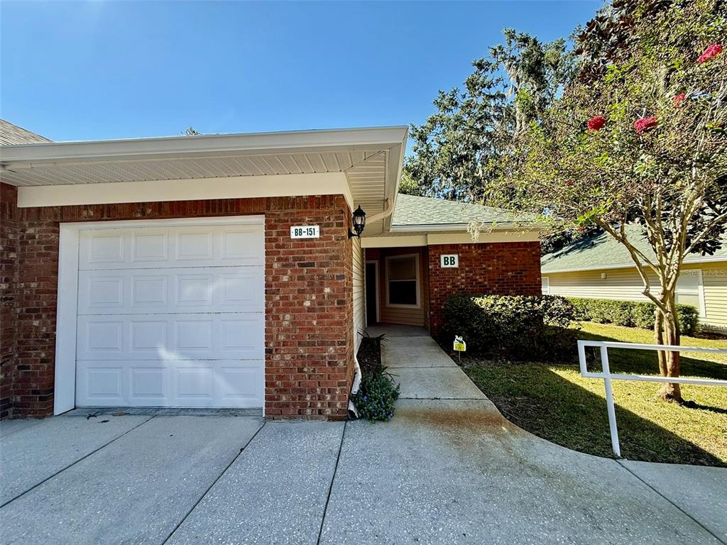 an outdoor view of house and garage