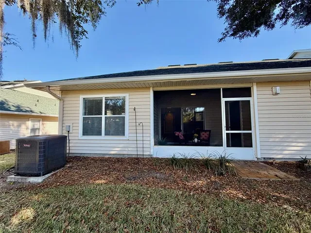 front view of a house with a large window