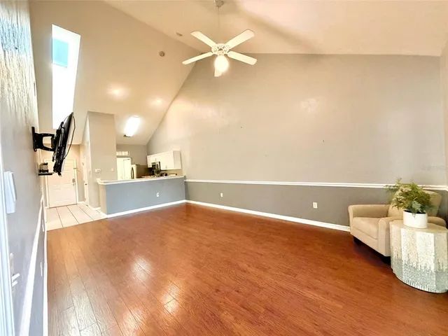 a view of a kitchen with kitchen island and a wooden floor