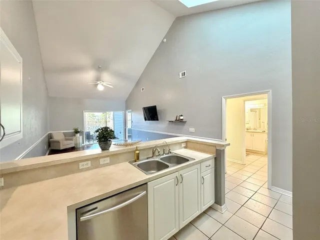 a kitchen that has a sink and a stove in it